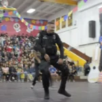 Officer takes floor with students and shows off moves that earn over 20M views (VIDEO)